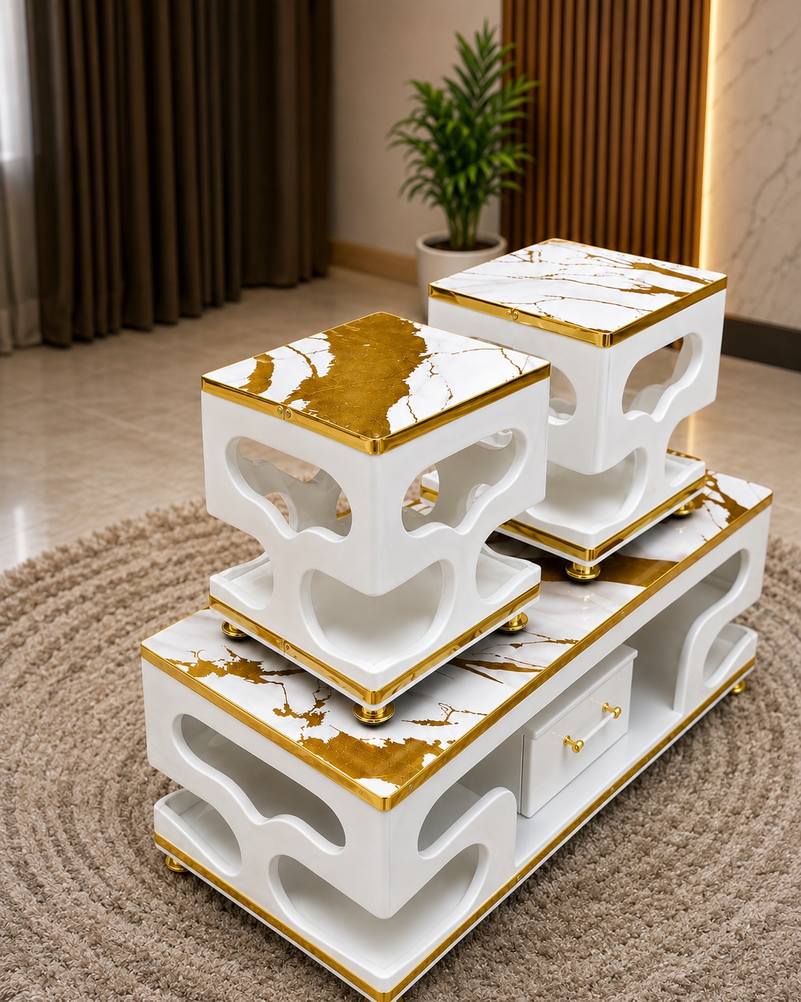 White and gold coffee table set with marble-effect tops, curved open shelving and storage drawer