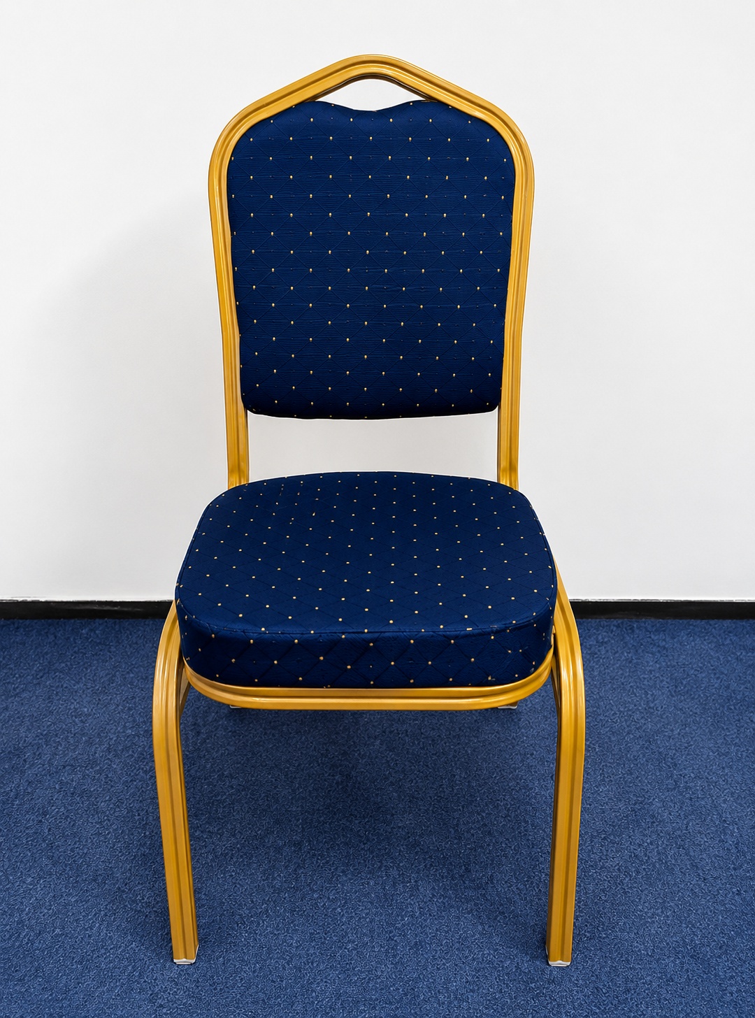 Blue banquet chair with padded fabric seat and backrest, gold powder-coated steel frame, suitable for conferences, hotels, churches, and events.
