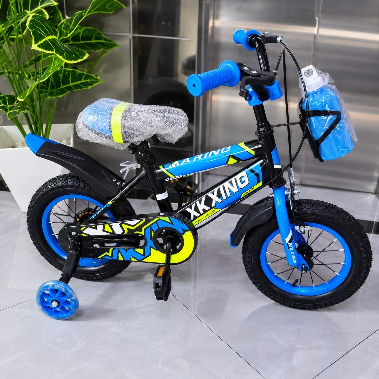 XKXING 12-inch blue and black kids bicycle with removable training wheels, water bottle, mudguards, and enclosed chain guard.