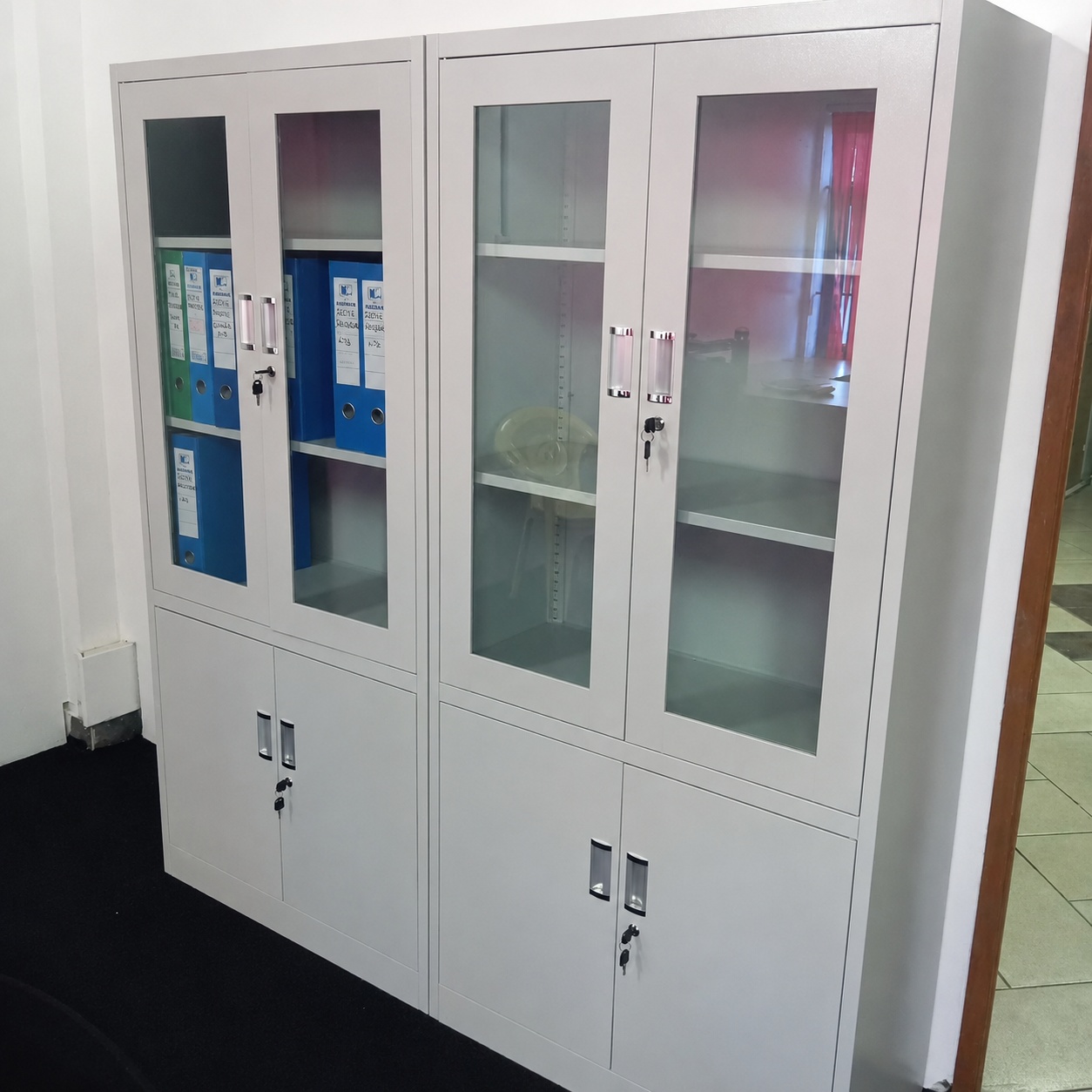 Full-height steel filing cabinet with lockable glass doors, adjustable shelves, and lower storage compartments, designed for secure office document and file org
